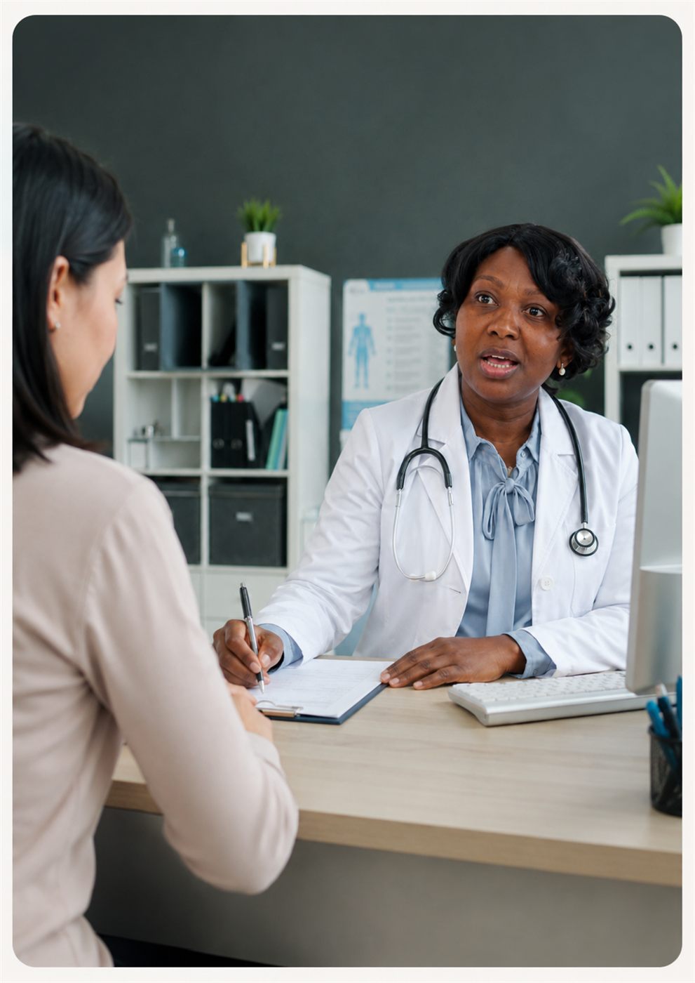 Dr Mabe consulting with a patient